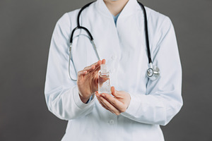 Doctor holds sanitizer featuring wear a mask, china, and anti bacterial