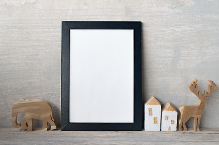 Blank frame poster on wall featuring advertising, apartment, and art, a Business Photo by ptystockphoto