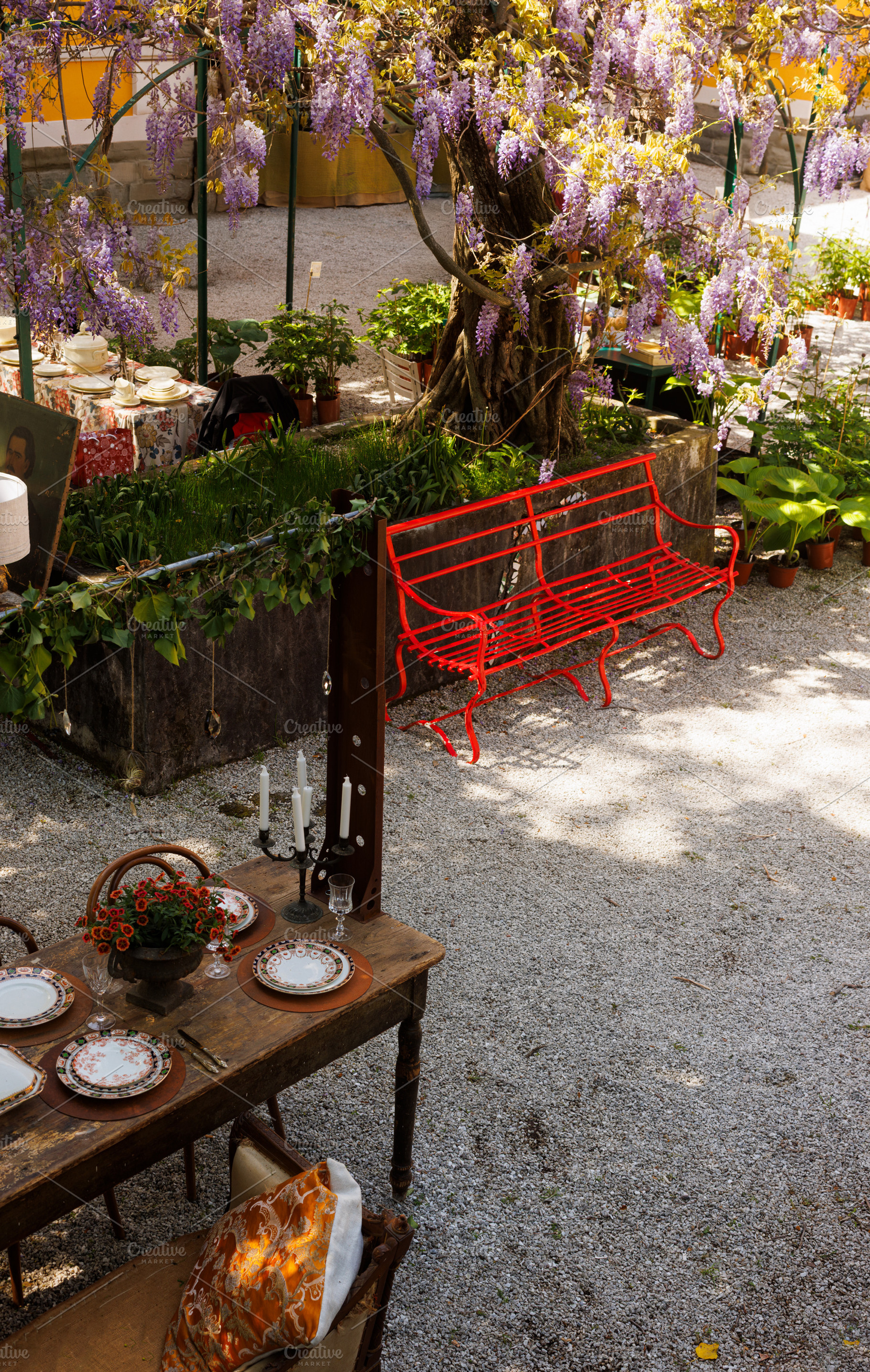 Outdoor wooden table set with vintage plates, a Holiday Photo by Bepslabor