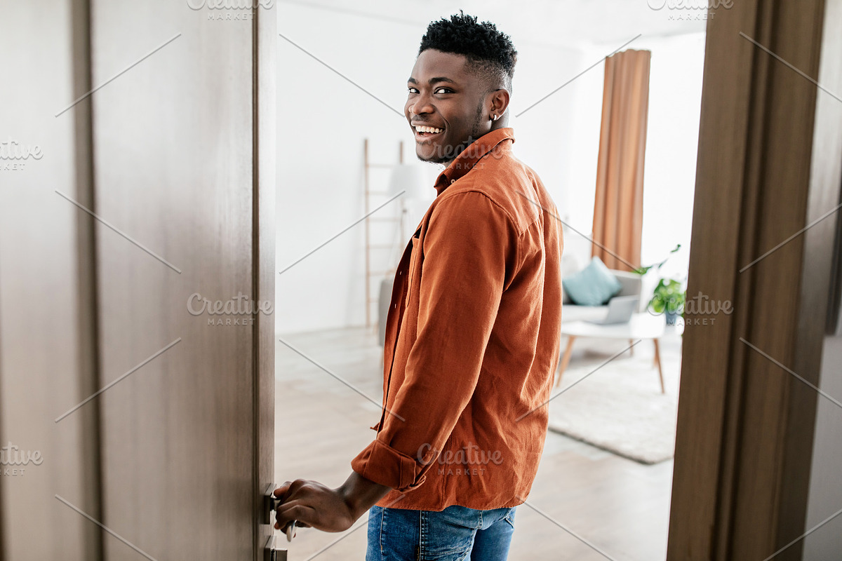 Joyful African American Male Entering His New Apartment Opening Door, a Photo by Prostock-Studio (Photo 1 of 2)