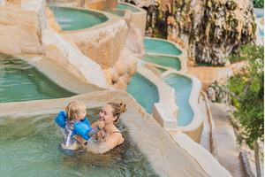 Mother and her toddler bathing in, a Holiday Photo by Elizaveta Galitskaya