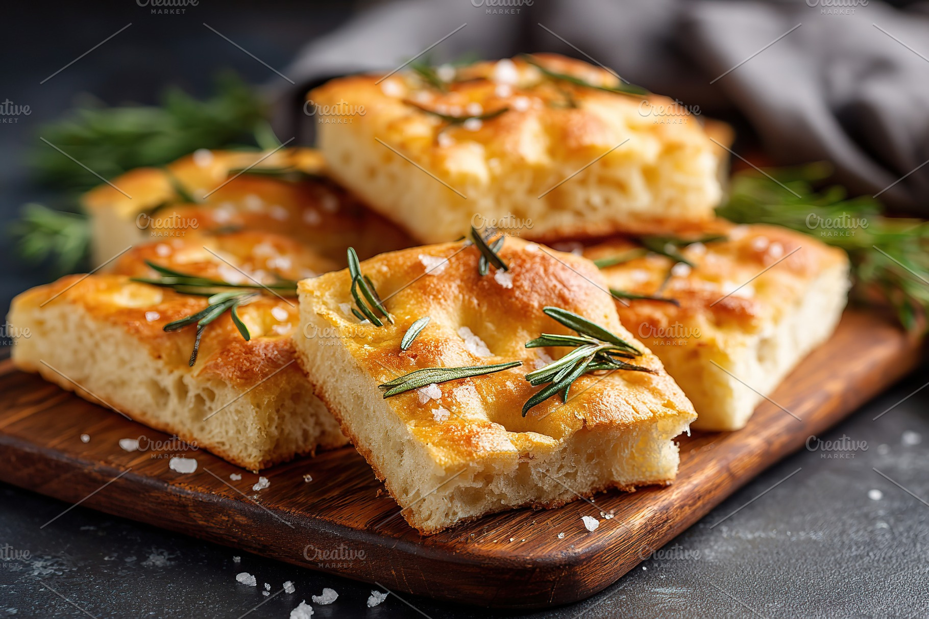 Freshly baked focaccia bread with rosemary on a wooden board in a cozy kitchen, a Food & Drink Photo by AlyaAnd