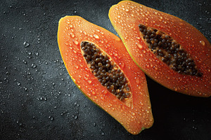Ripe papaya halves showcasing, a Photo by Pavel_design