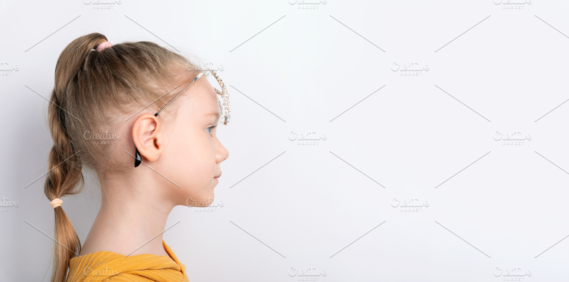 Profile of Young Girl with Headphones, a Photo by Ales Munt