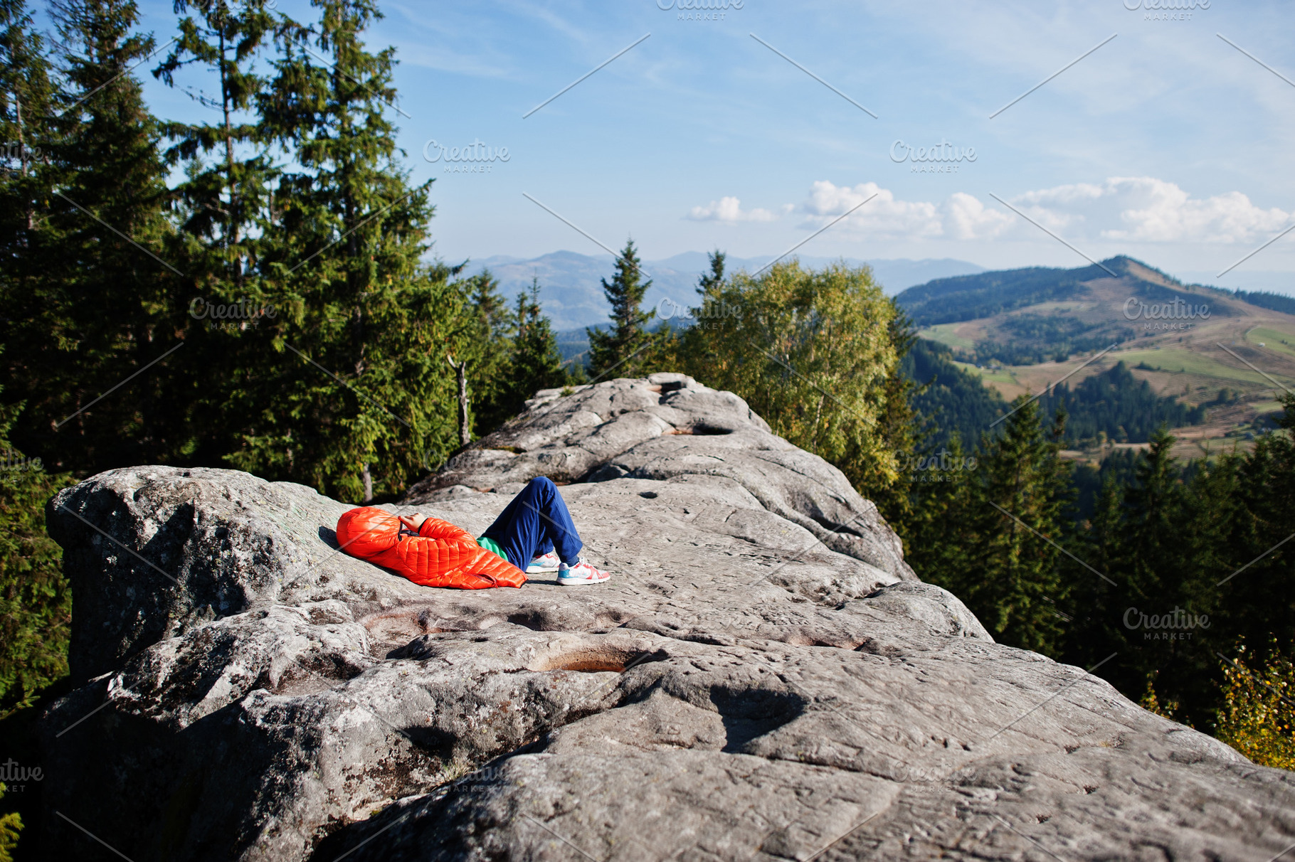 Children hiking on beautiful day in mountains, resting on rock a, a Nature Photo by AS photostudio