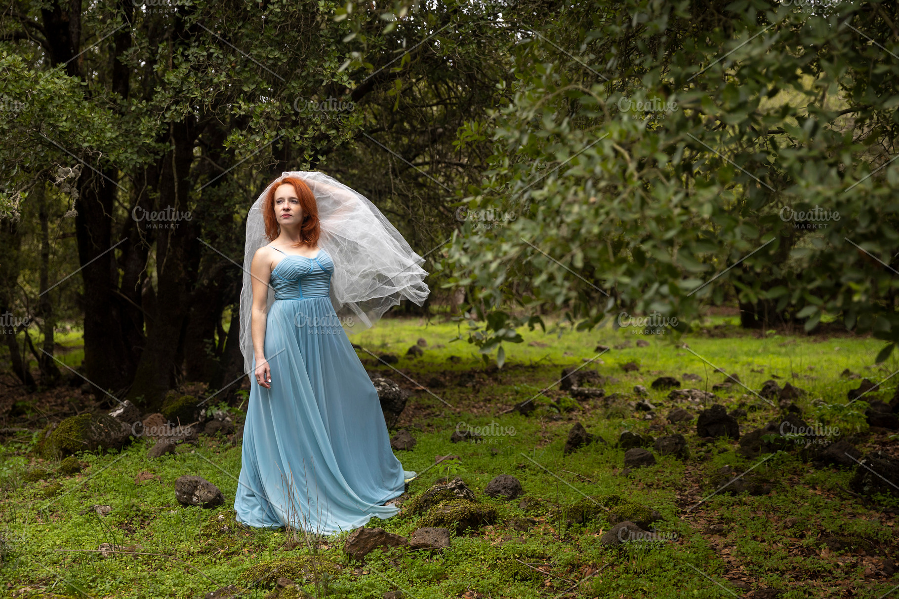 Woman in a flowing blue dress and br, a Person Photo by Imaginarium