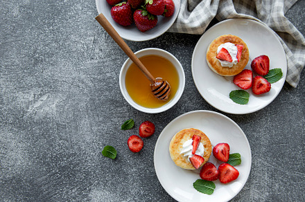 Cottage cheese pancakes, ricotta fritters on ceramic plate with, a Food & Drink Photo by Olena Rudo