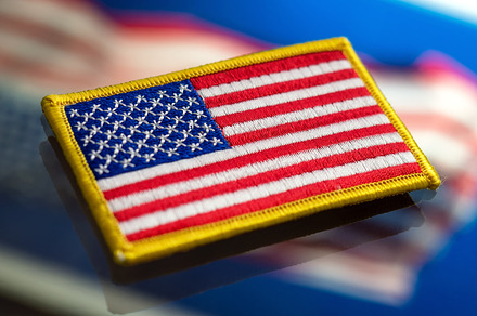 USA flag patch on glass surface