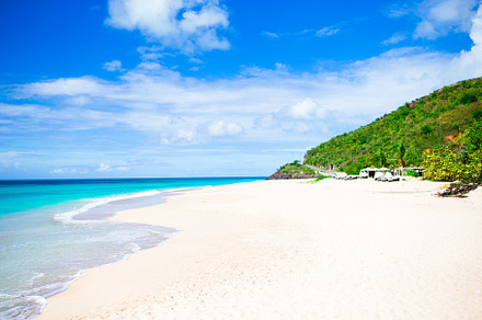 Idyllic tropical beach with white sand turquoise ocean water and blue sky on, a Nature Photo by travnikovstudio