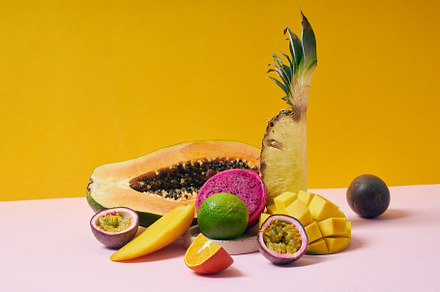 Tropical fruits variety on a colorful background. Side view with