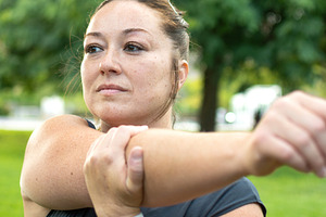 Athletic Woman Stretching Shoulder Before an Outdoor, a Sports & Recreation Photo by etorres69