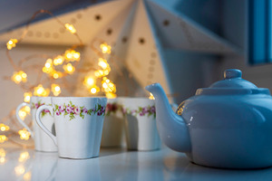 White porcelain teapot and cups with, a Holiday Photo by Imaginarium