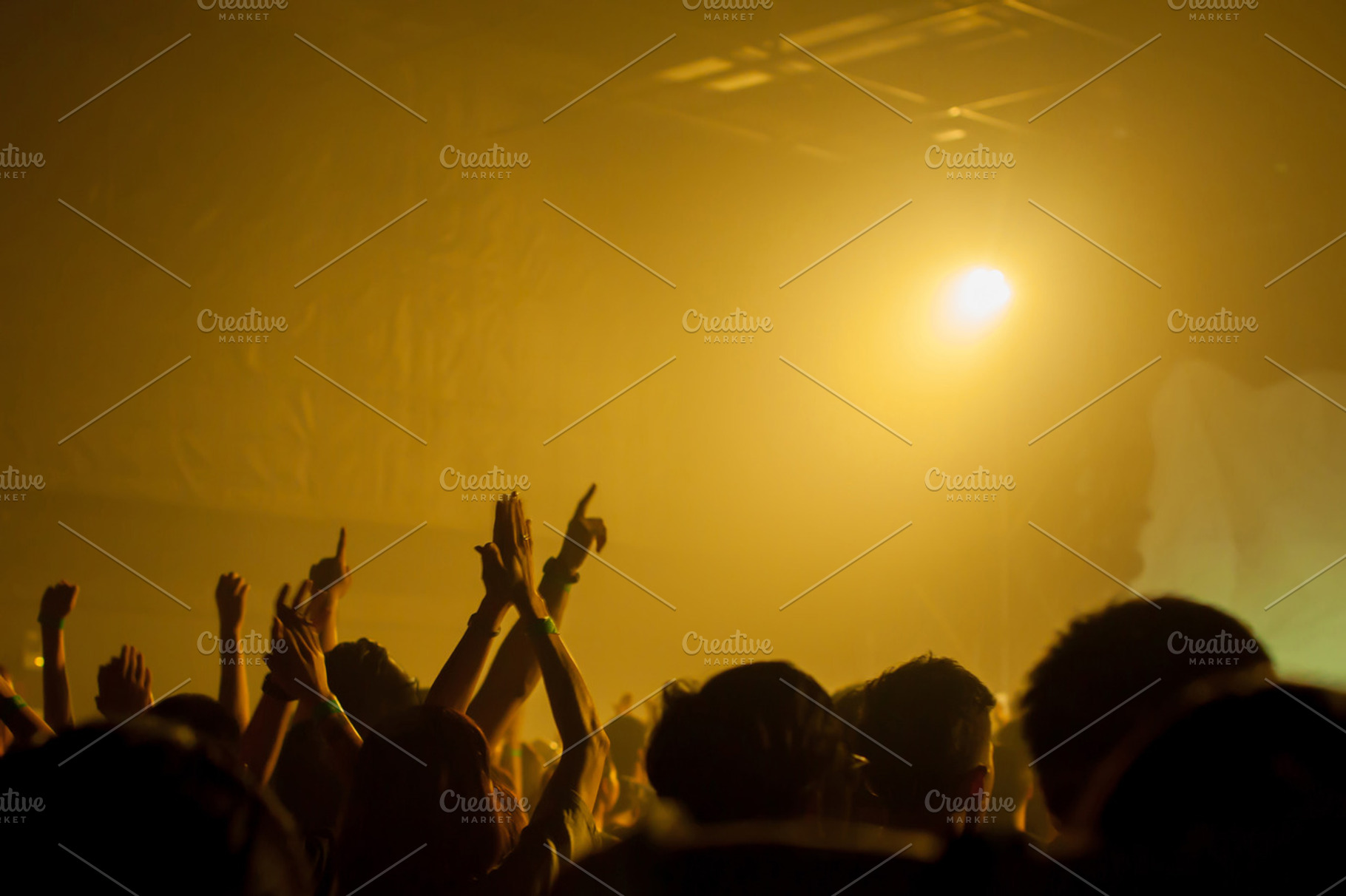 Music band crowds raising hands up in the air selective focus stock photo, an Arts & Entertainment Photo by Twinster Photo