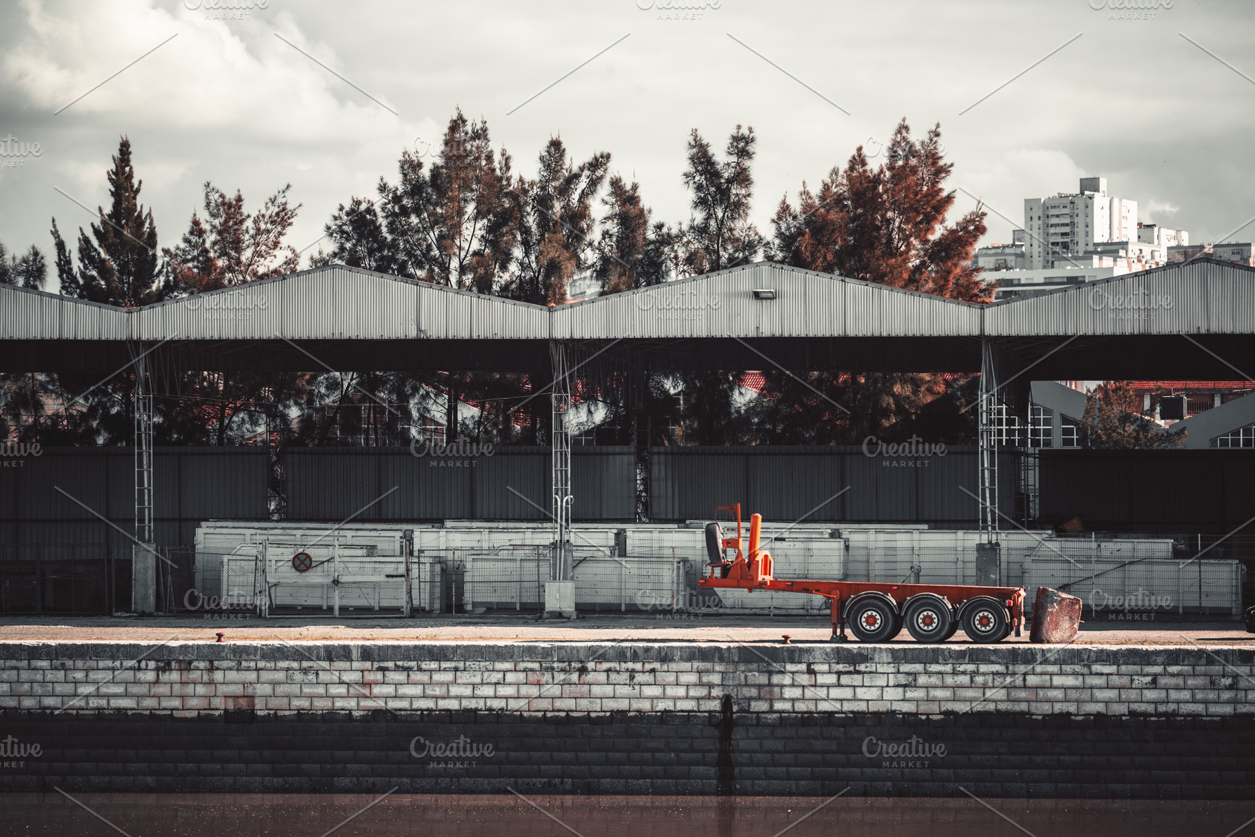 Industrial dock with orange trailer, an Industrial Photo by SkyNext