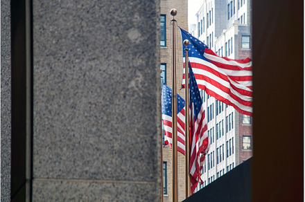 Flags of the United States waving in, an Architecture Photo by Oleksandr Berezko