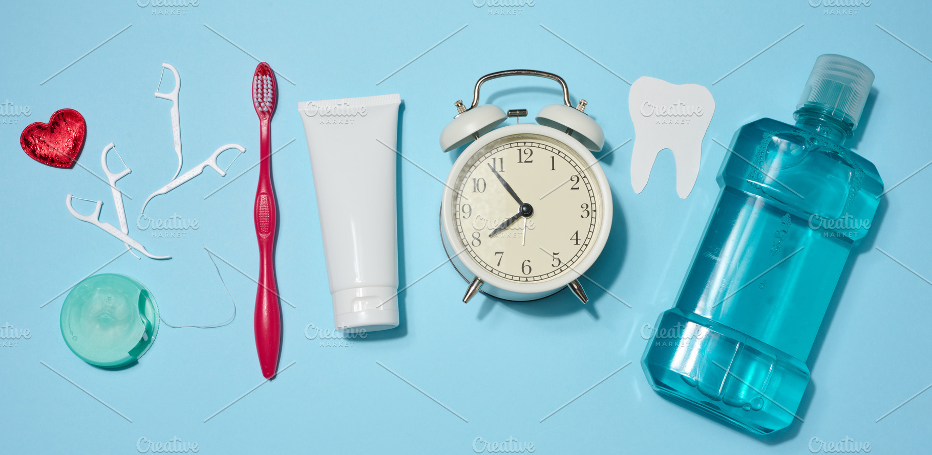 Set of oral hygiene products and items including red toothbrush,, a Health & Medical Photo by ndanko