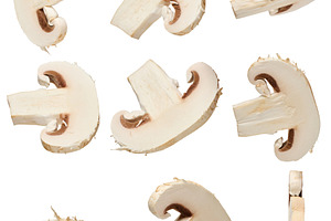 Sliced pieces of raw champignon mushroom in different angles on, a Food & Drink Photo by ndanko