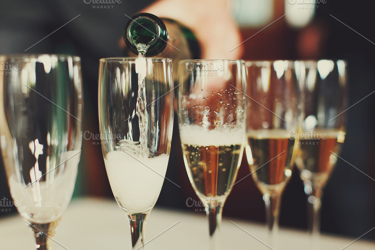 Man pours champagne in wineglasses, a Food & Drink Photo by IvashStudio (Photo 2 of 2)