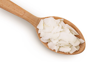 Coconut flakes or chips in wooden
