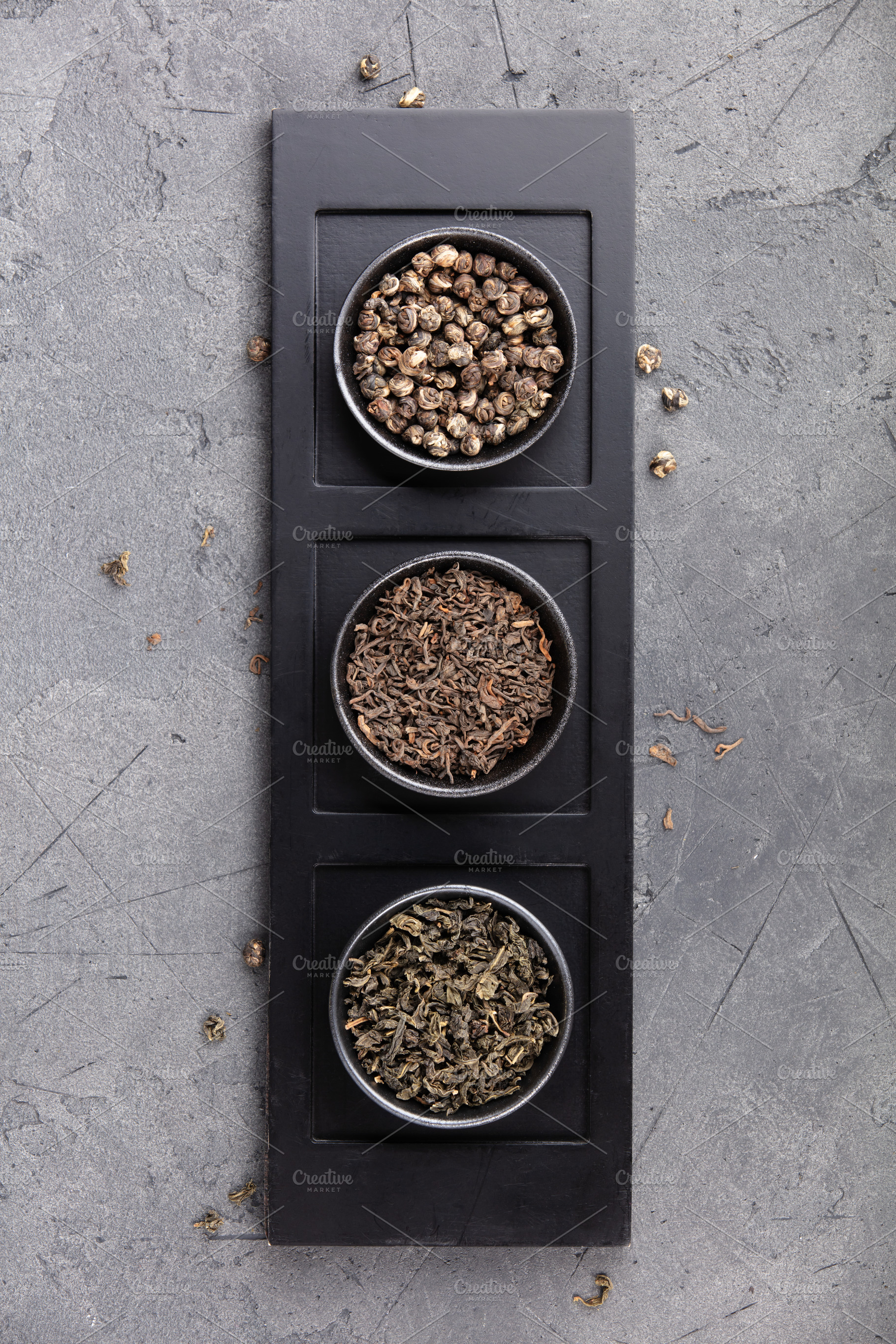 Assorted Loose Tea Leaves in Bowls on Dark Stone Background, a Food & Drink Photo by Natalia Klenova's Shop