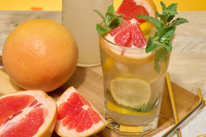Glass with cool drink garnished with mint, lemon and grapefruit., a Food & Drink Photo by ndanko