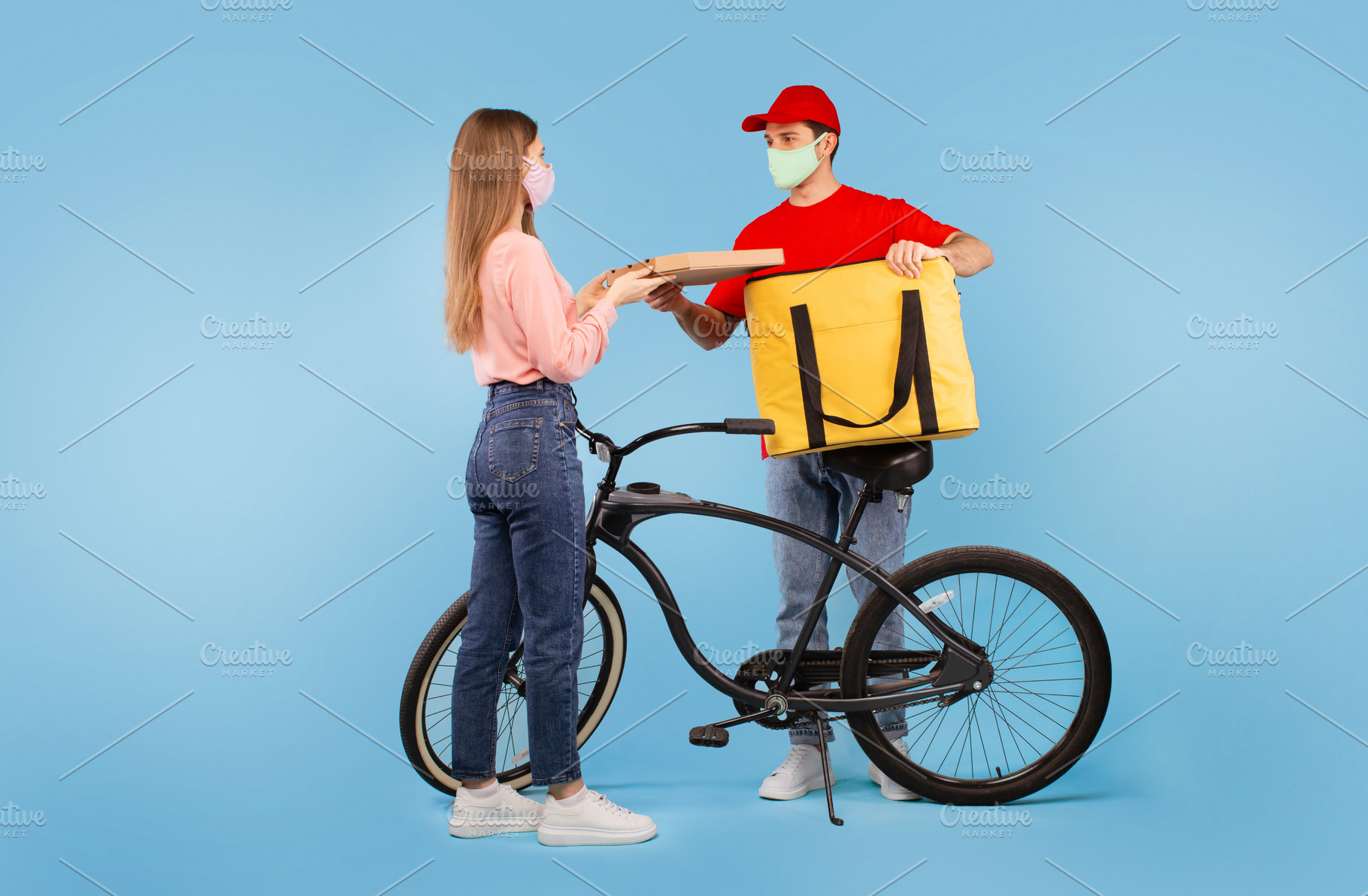Courier Giving Pizza To Female Wearing Face Mask, Blue Background, a ...