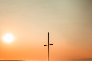 Cross christian featuring shapely, symbol, and dusk