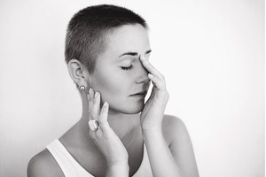 Woman with shaved head closing eyes, a Beauty & Fashion Photo by Anna Efetova