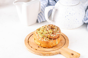 Cinnabon with trendy Dubai chocolate topping, a Food & Drink Photo by Rimma