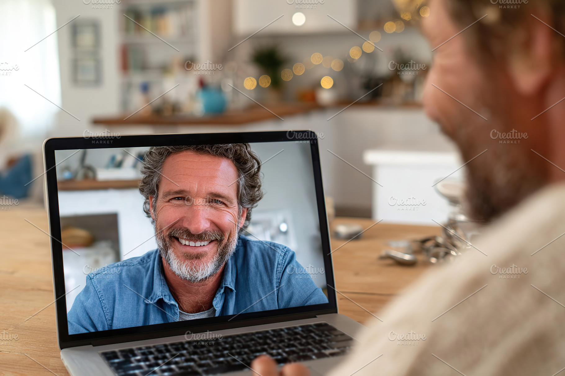 Therapy session in progress with a smiling man on a virtual call in a cozy home, a Technology Photo by AlyaAnd
