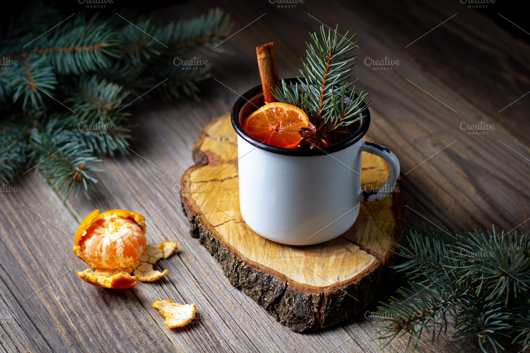 Traditional tasty mulled wine hot drink with mandarin apple spices and christma, a Food & Drink Photo by dashtik