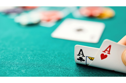 Close-up of a hand holding two aces, a Food & Drink Photo by Sergey Kotenev