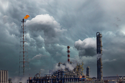 Fire from a gas torch and smoke stacks, an Industrial Photo by aagafapaperiapunta
