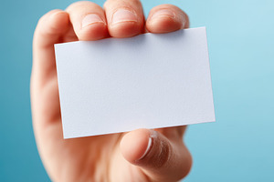 Hand holding a blank card against a blue background, a Background Photo by AlyaAnd