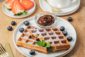 Belgium waffles Homemade waffles with strawberries, a Food & Drink Photo by Budarinphoto