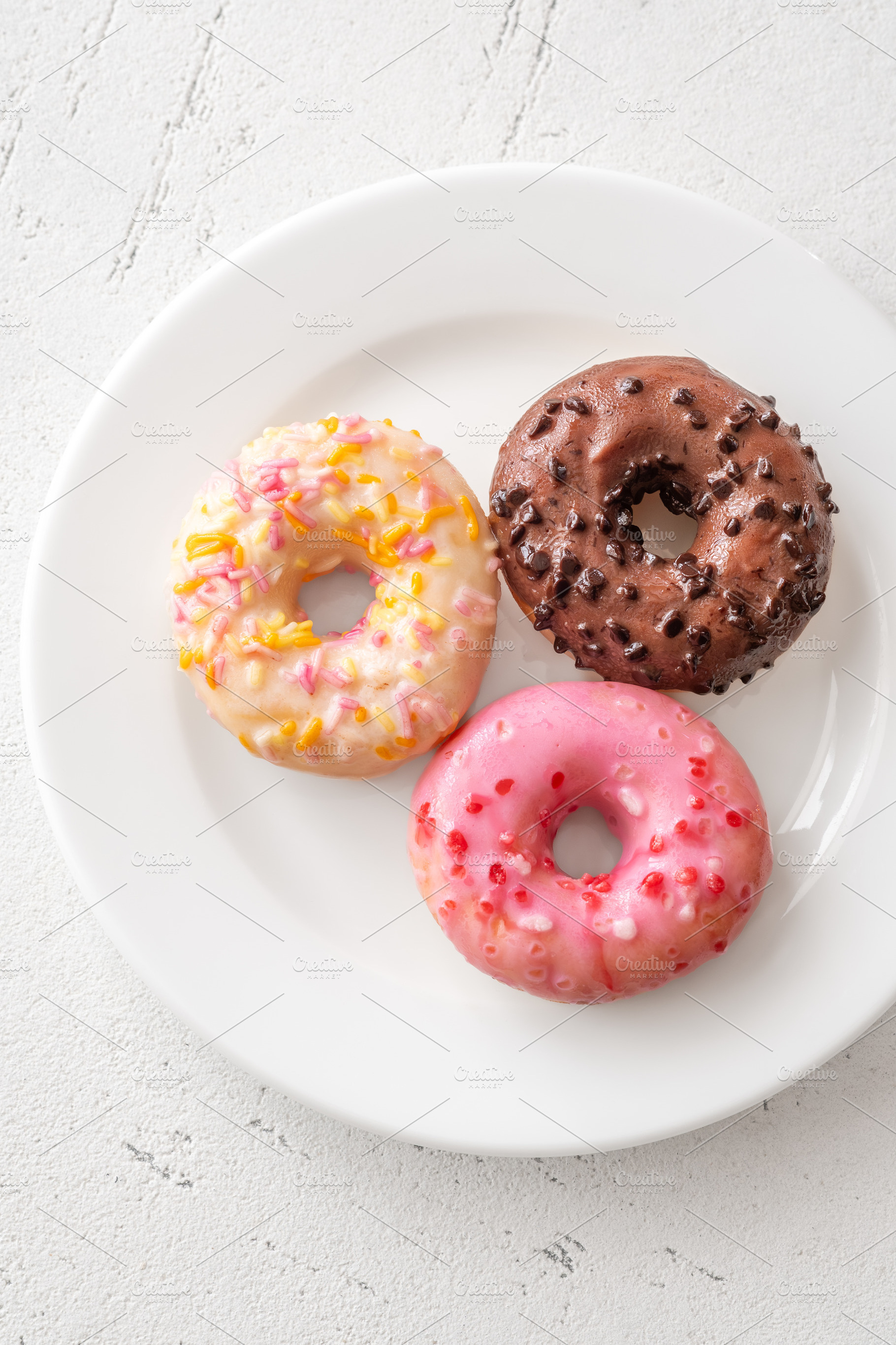 Pink white chocolate glazed donuеі, a Food & Drink Photo by Alexander Prokopenko
