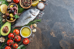 Raw dorado fish with spices and vege, a Photo by Volff
