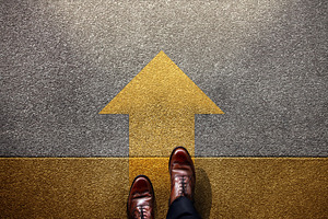 Standing at yellow Arrow on the road, Determination, direction,, a Photo by salmon.black
