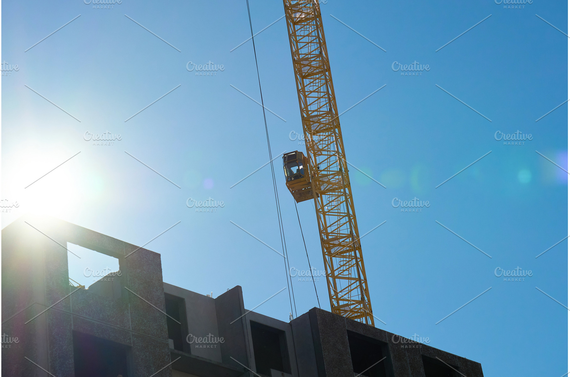 Two large cranes stand tall against, an Industrial Photo by darksoul72