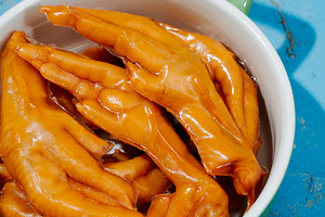asian chicken feet coated in gelatin in a casserole, a Photo by Nito