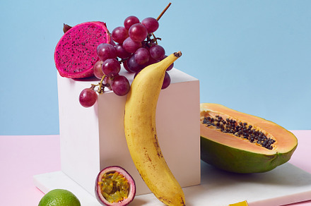 Tropical fruits variety on a colorful background. Side view with