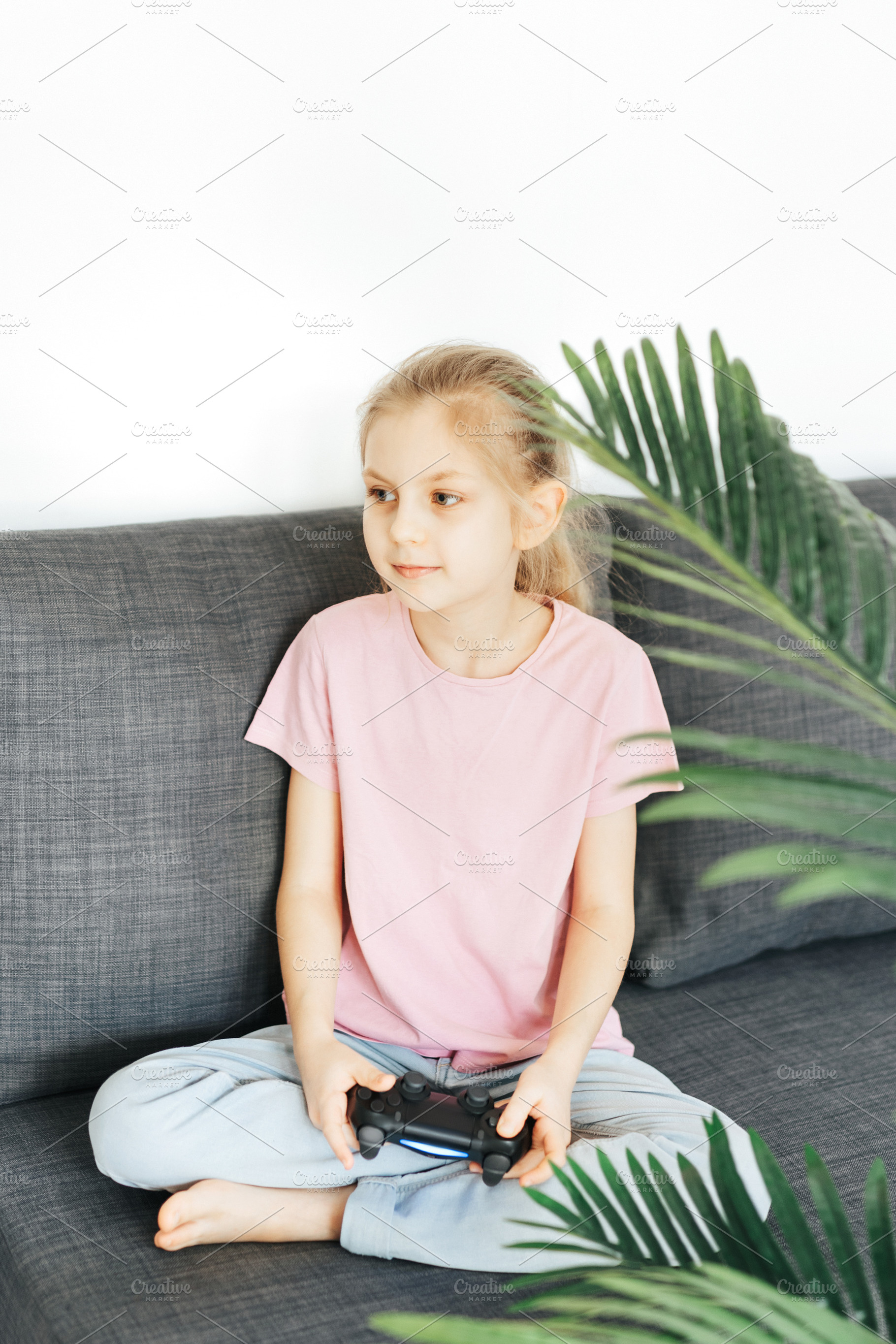 Girl playing video game at home, a Sports & Recreation Photo by Olena Rudo