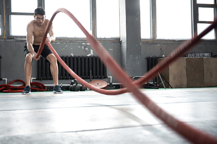 man with battle rope doing exercise, a Sports & Recreation Photo by OPOLJA