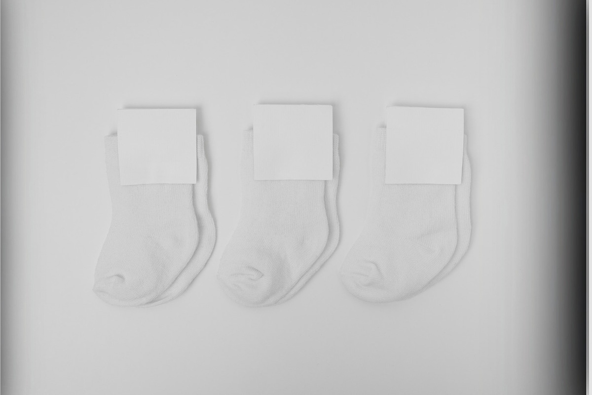 Minimalist Baby Socks Mockup, a Bottom Mockup by The Marco (Photo 2 of 3)