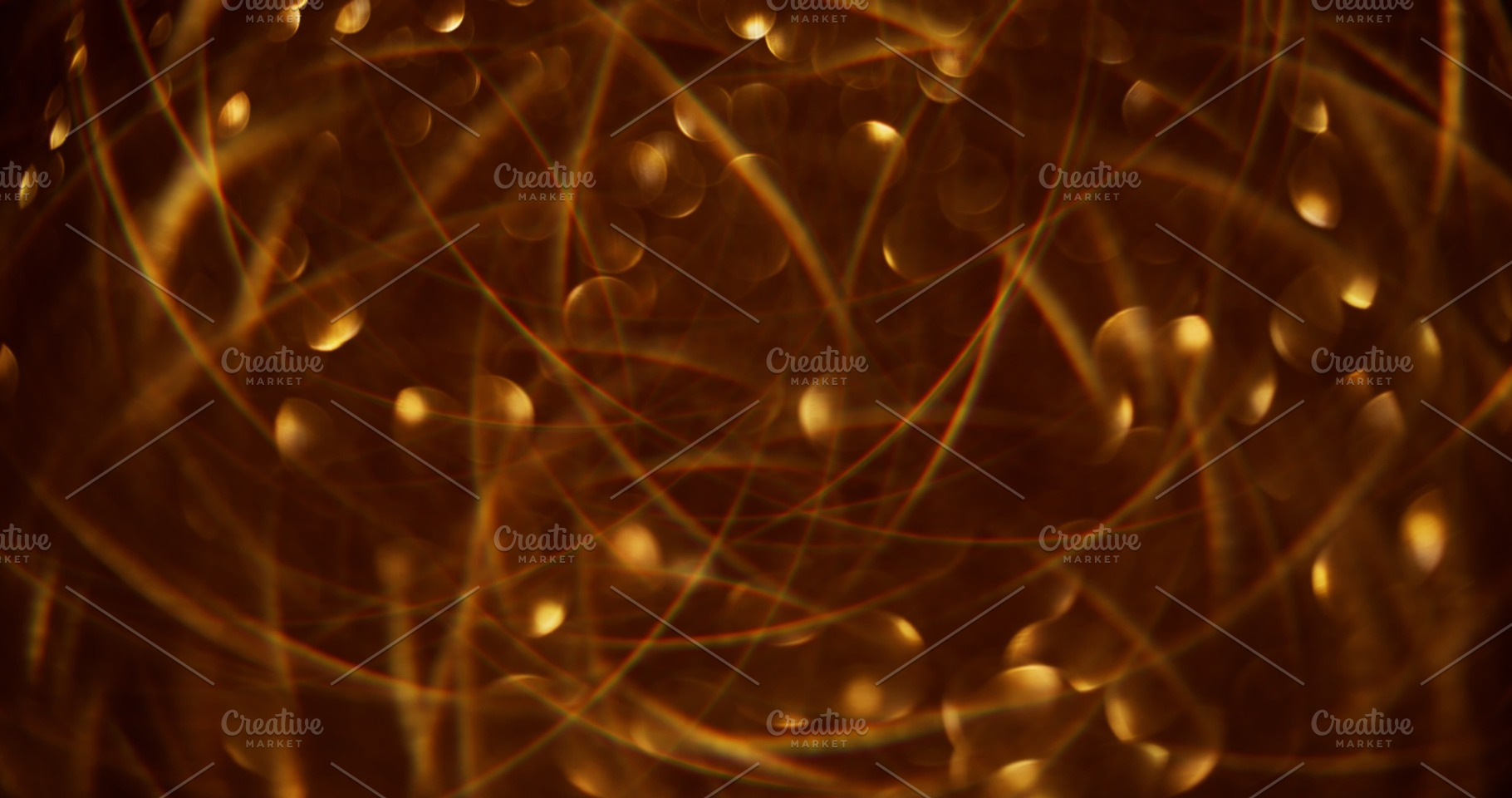 Defocused glittering garland bokeh light golden, a Background Photo by Photo Drive Studio