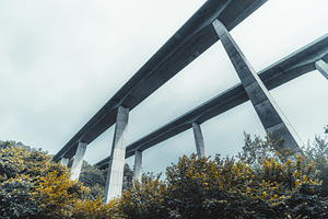 Low-angle viaducts in rain mist, an Architecture Photo by SkyNext