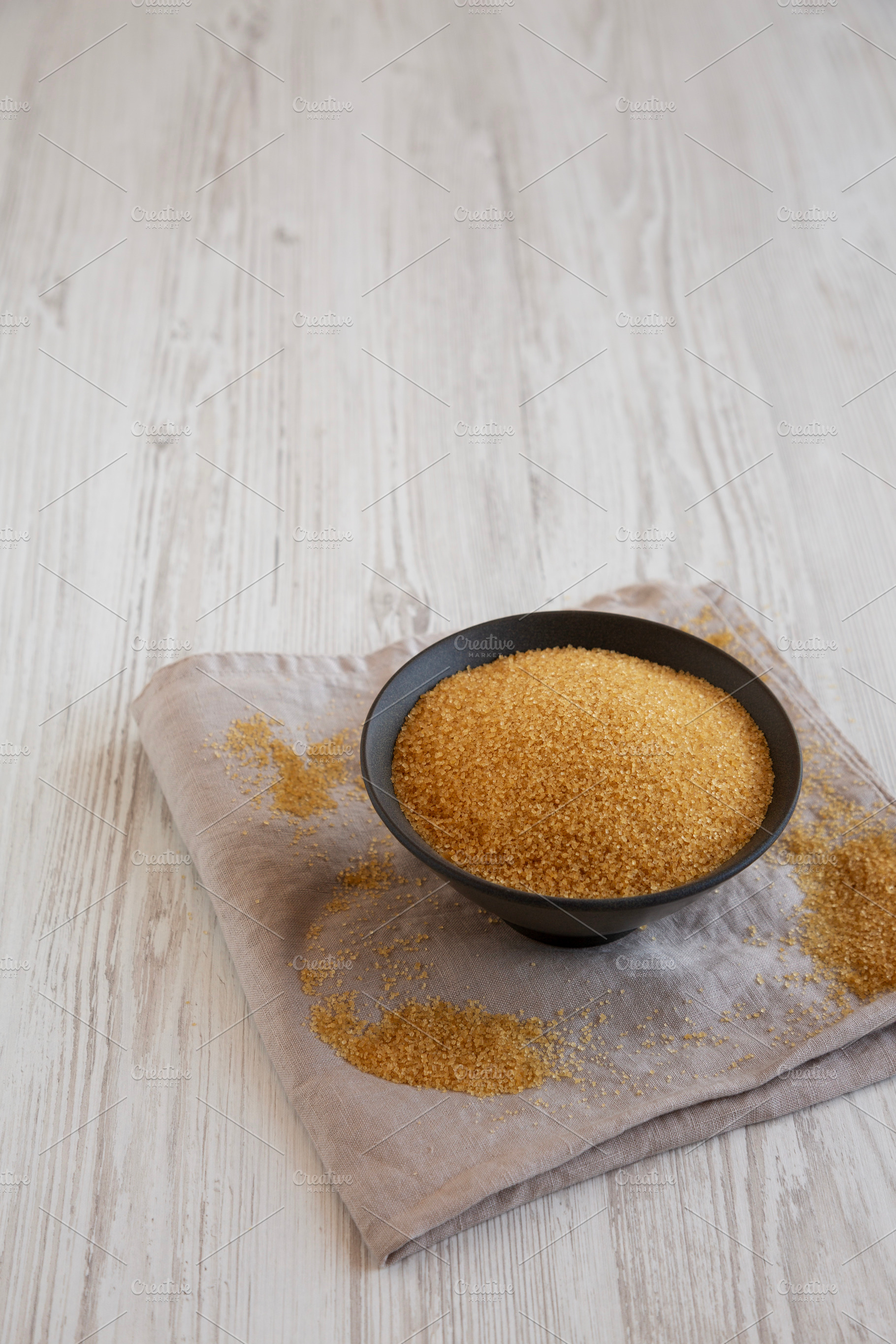 Organic Demerara Sugar in a Bowl, side view. Copy space., a Food & Drink Photo by LiudmylaChuhunova