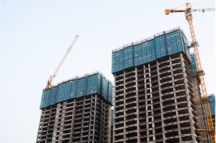 Tall unfinished skyscrapers with