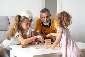 Happy grandparents playing with their granddaughters, a Photo by etorres69