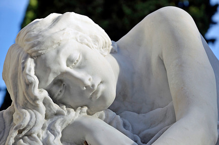 sculpture woman resting in the cemetery
